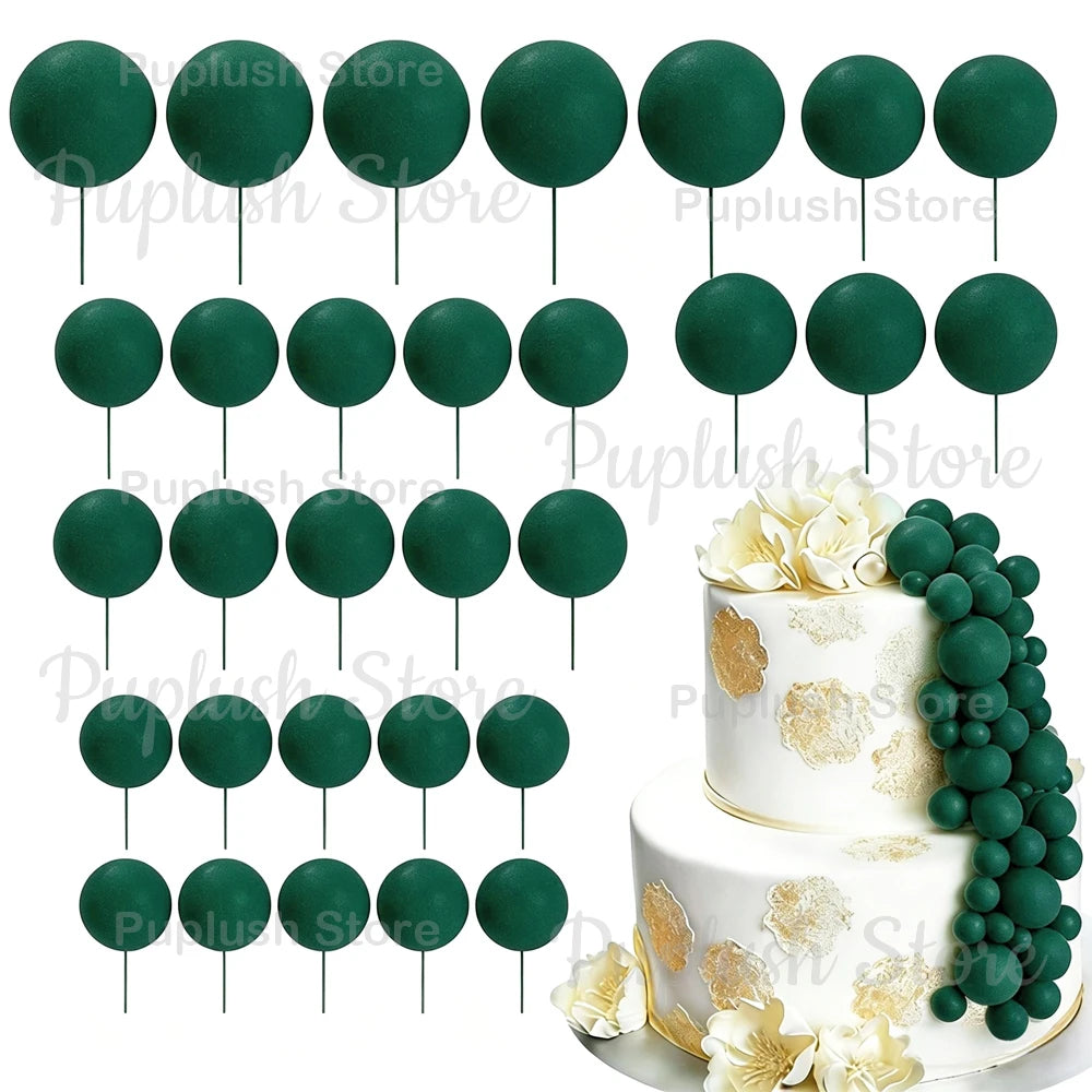 A set of green foam cake toppers on sticks, including round and leaf shapes.