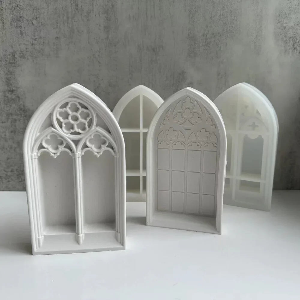 White silicone molds shaped like gothic church windows for crafting