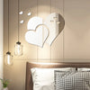 Elegant 3D acrylic heart wall art decals hanging on a wall with a bed in the foreground