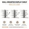 A set of three wall-mounted display shelves made of metal for storage and display.
