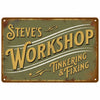 A vintage metal sign with distressed green and brown tones featuring the text Steve's Workshop Tinkering & Fixing