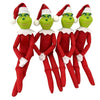 Trois figurines d'elfes vertes en peluche vêtues de tenues de Noël rouges