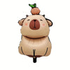 A plush capybara decoration set featuring a foil balloon and banner for a birthday party.