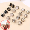 A collection of silver and gold pearl and rhinestone no-sew brooch buttons for crafting