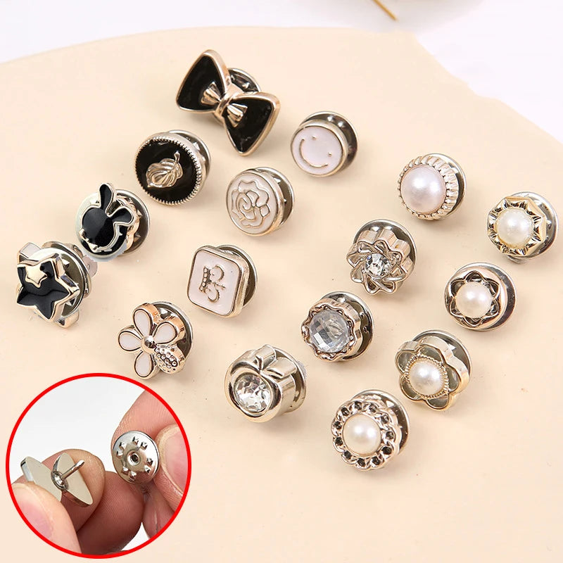 A collection of silver and gold pearl and rhinestone no-sew brooch buttons for crafting