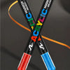 A pair of black and blue acrylic paint markers are shown diagonally, highlighting a smart precision ink control system.