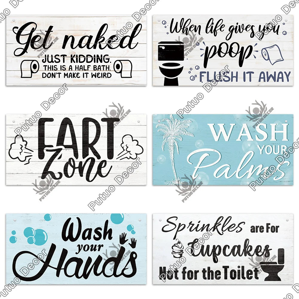 A collection of rustic wooden wall signs with humorous messages about nudity, farting, and handwashing.