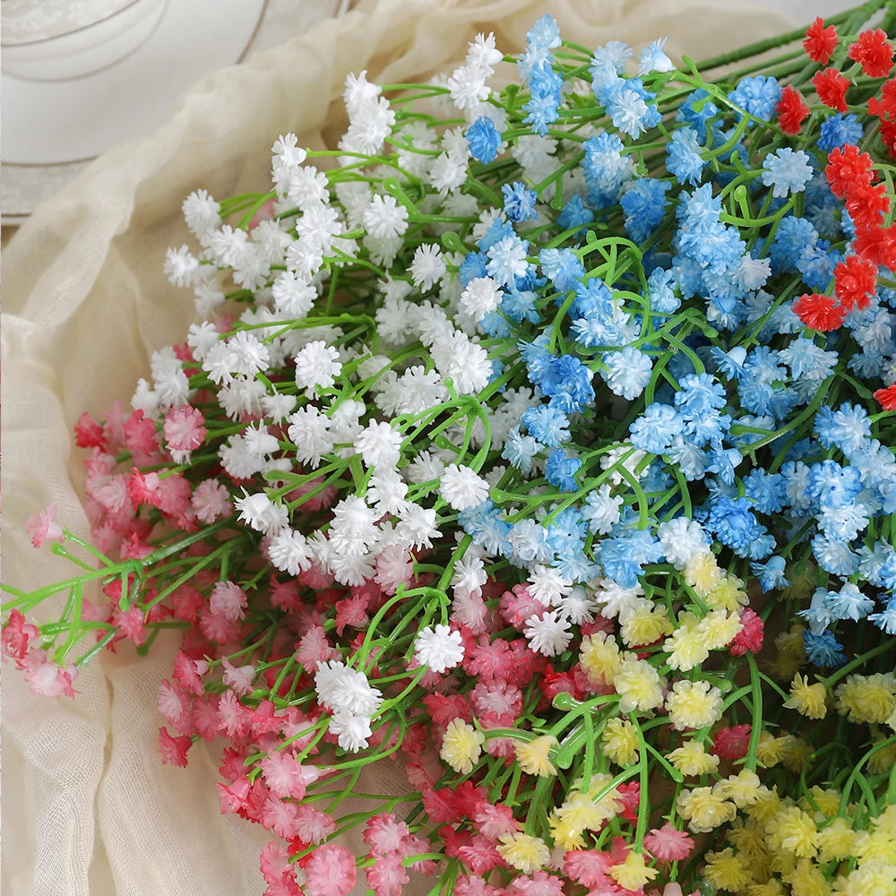 A bouquet of artificial baby's breath flowers in various shades of white, blue, pink, and red.