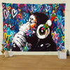 A vibrant tapestry featuring Banksy-inspired street graffiti art with colorful paint splatters and a hand gesture.