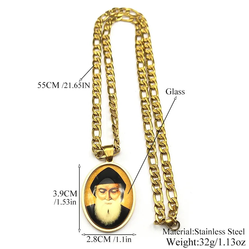 A gold-colored stainless steel medal pendant necklace featuring a glass charm with a depiction of Saint Charbel.