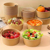 A collection of disposable kraft paper lunch bowls filled with various foods like fruit and salad.