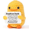 Handmade knitted yellow duck plush toy with an inspirational card