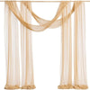A set of two sheer beige chiffon fabric panels draped as a wedding arch backdrop.