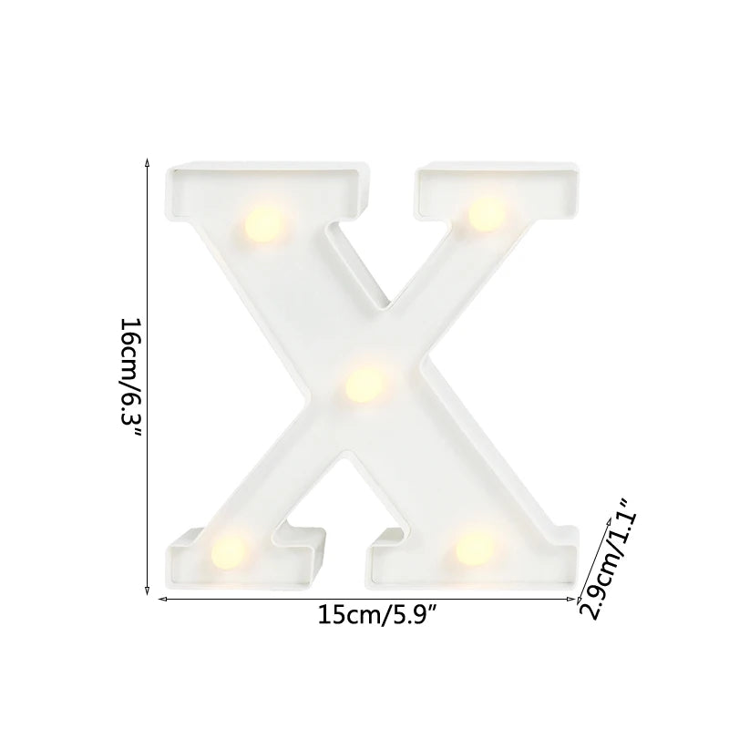 A white alphabet letter light shaped like the letter X with warm white LED illumination.