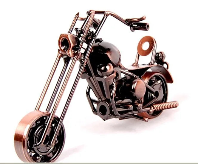 A handcrafted metal motorcycle model with copper and black finish displayed against a white background.