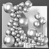 A display of metallic silver balloons arranged in a balloon garland arch with confetti accents.