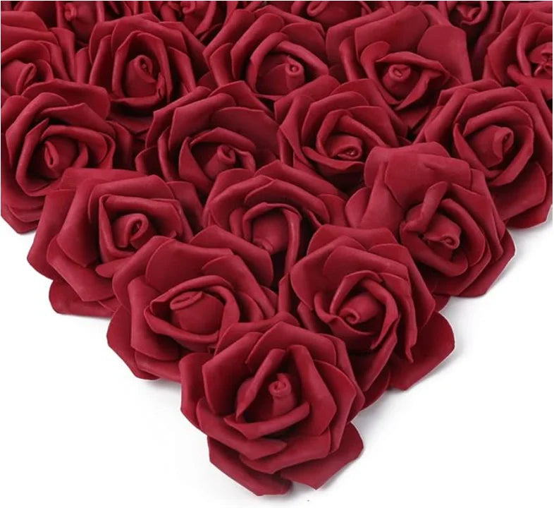 A dense cluster of deep red artificial foam roses.