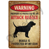 A vintage metal sign with a warning that property is protected by an attack beagle and the beagle is protected by a gun.