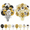 A collection of black, gold, and white graduation balloons featuring cap and star designs.