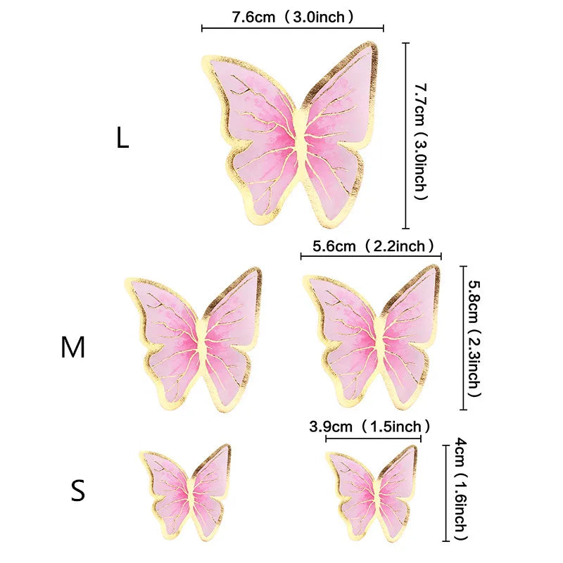 Three butterfly cake toppers in light pink and gold glitter, varying in size.
