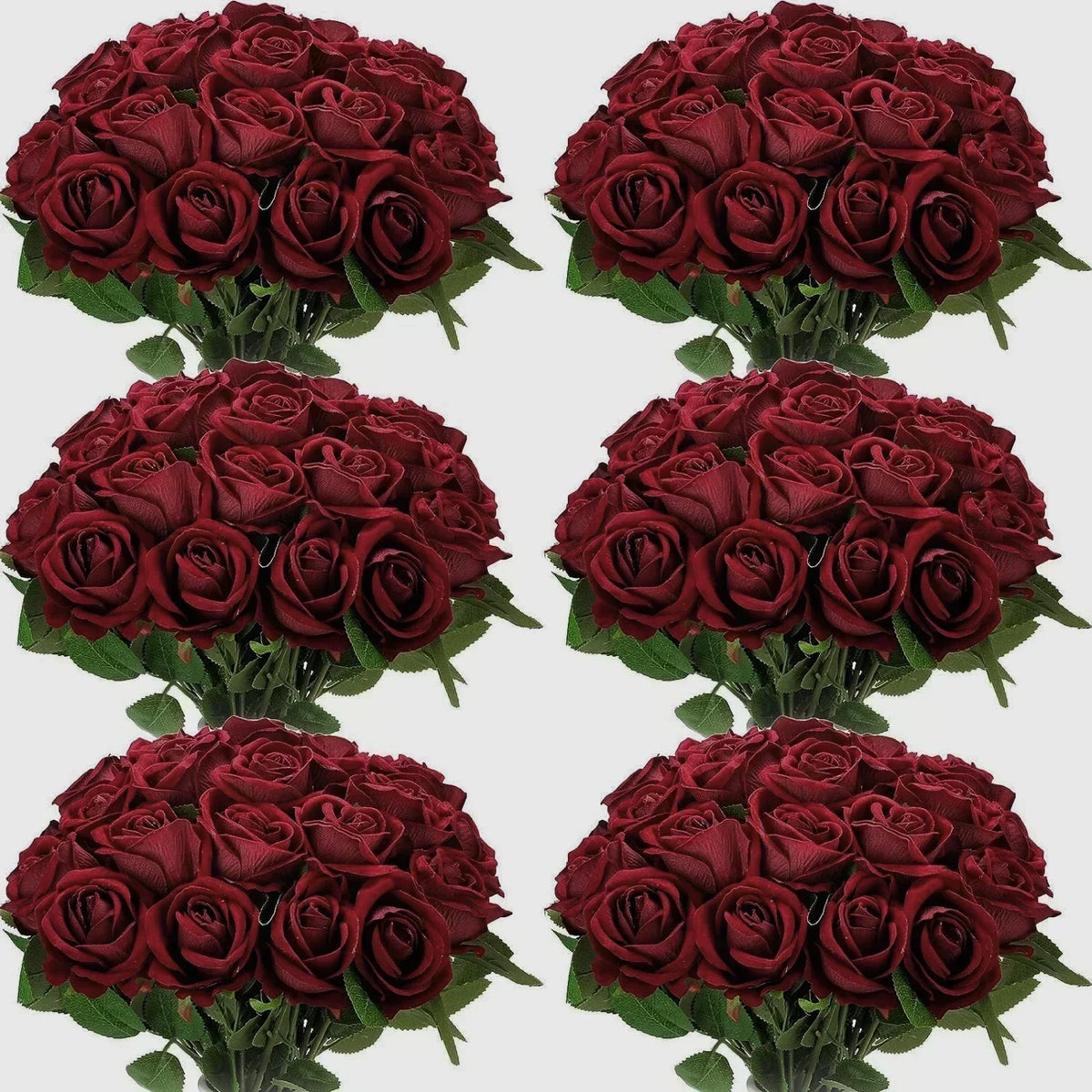 A collection of deep red artificial silk roses arranged in bouquets for table decor.