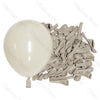 A bunch of latex balloons in neutral shades, including one large white balloon, for baby shower and birthday décor.