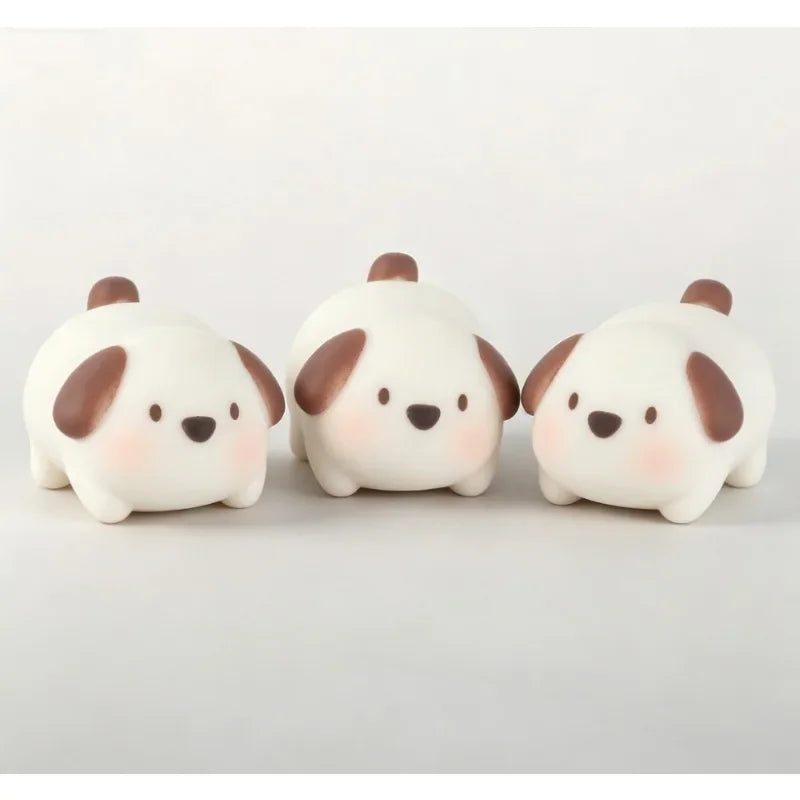 Three white and brown pig-shaped mochi squishy stress relief toys arranged side by side.