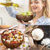 Three natural coconut shell serving bowls filled with various dried fruits and nuts.