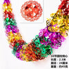 A vibrant, multi-colored tinsel garland ribbon featuring various metallic and iridescent colors for holiday decoration.