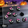 A variety pack of 50 Halloween resin nail charms featuring black and pink bats and flowers on a gray surface.