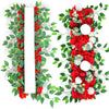A vertical arrangement of red roses and green foliage with a white rectangular insert for event decor.