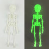 A set of poseable magnetic skull fridge magnets in bright neon green.