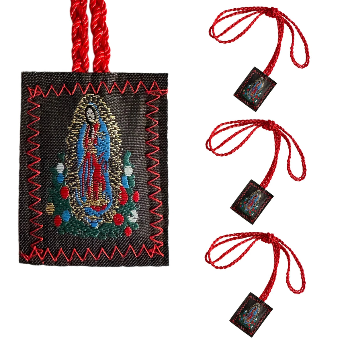 A multi-symbol Catholic pendant necklace set featuring a figure surrounded by a wreath on a dark fabric with red cord.