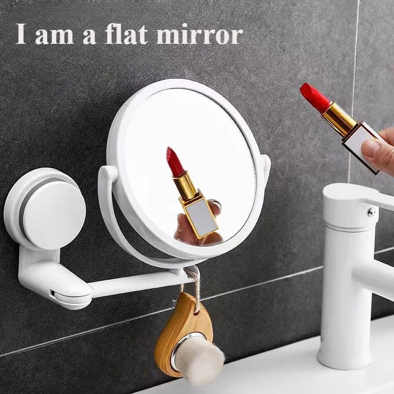 A wall-mounted vanity mirror is shown with a red cosmetic brush reflected in the surface.