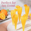 A set of disposable champagne glasses with a gold finish filled with orange juice and garnished with citrus slices.