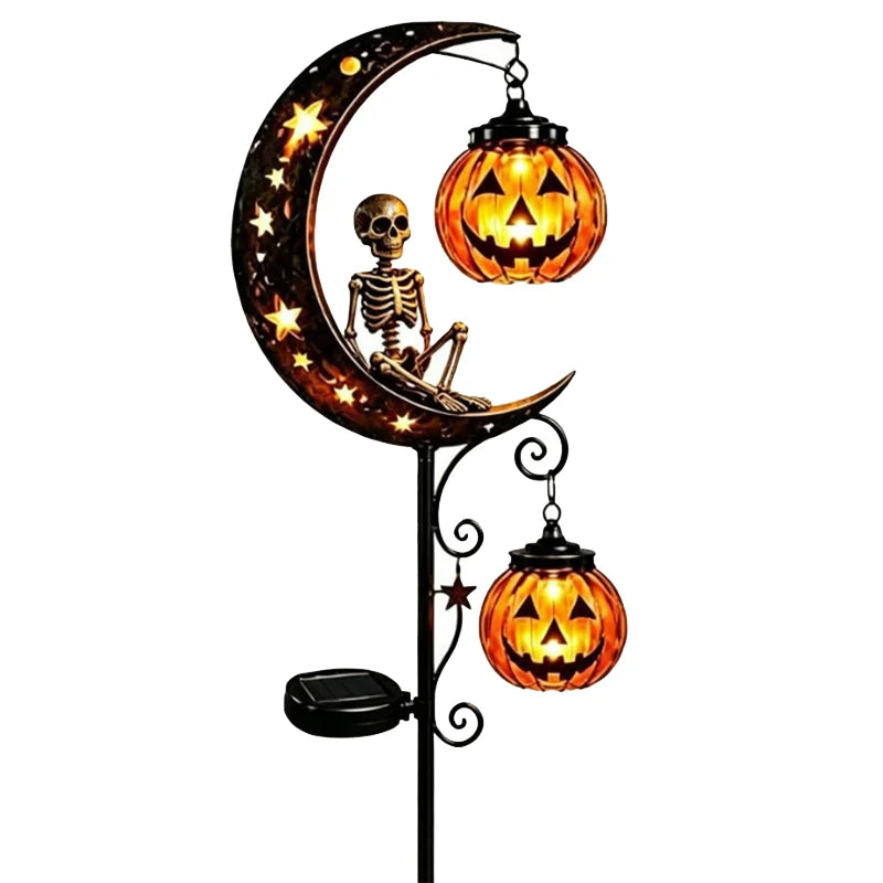 A solar Halloween moon lantern featuring a skull and crossbones design on the crescent moon.