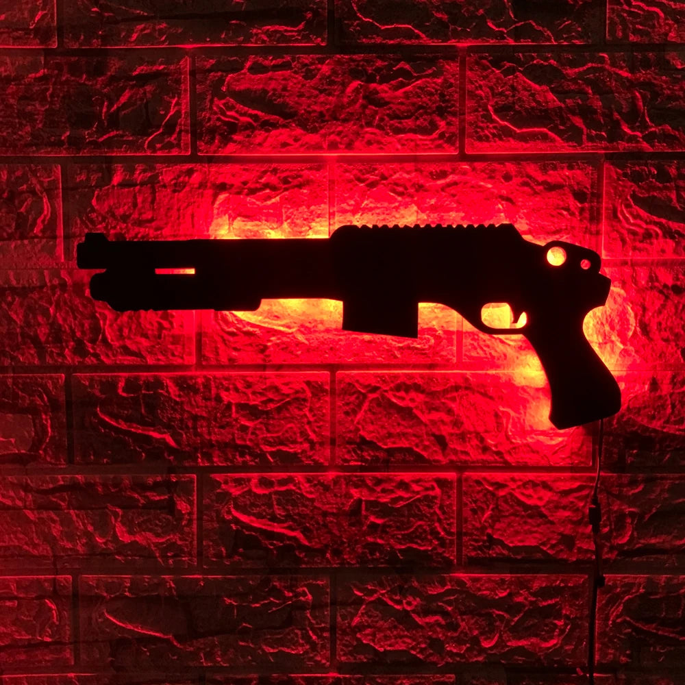 A silhouette of a gun-shaped light fixture mounted on a red brick wall.