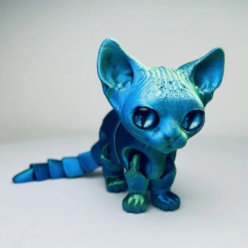A blue Siamese cat figurine with large eyes and detailed fur texture.