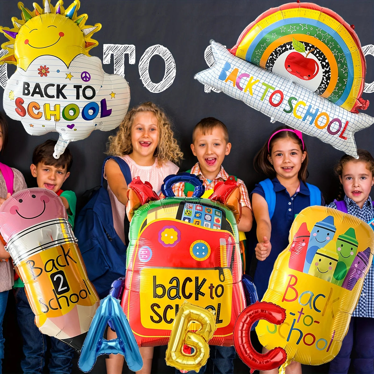 A collection of colorful aluminum foil decorations shaped like a sun, clouds, and a backpack for a back to school theme.