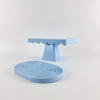 A light blue cupcake stand with a scalloped top and a matching round stand.
