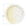 White disposable party plate decorated with gold dots