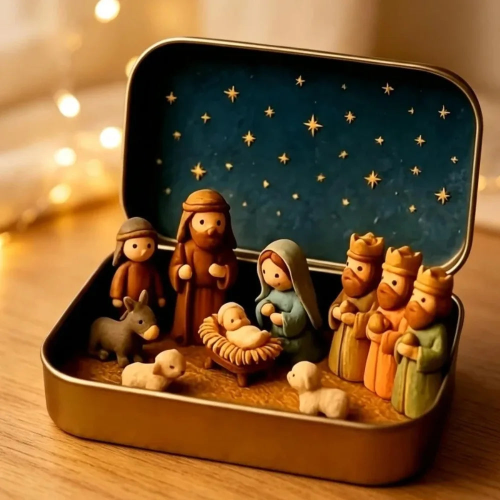 A gold box containing a miniature 3D printed nativity scene with figures and animals on a textured base.