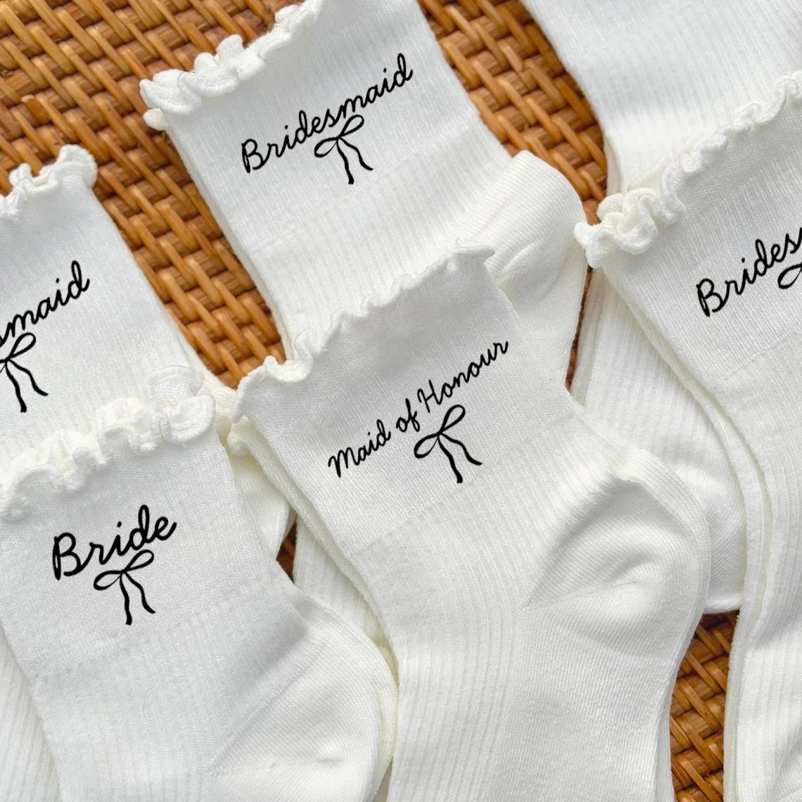 White knit socks for a bridal party including bridesmaid and maid of honor designs