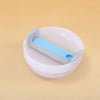 A white replacement tumbler lid with a light blue silicone cover is shown on a beige background.