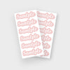 A sheet of pink name stickers with the word sample repeated on each label