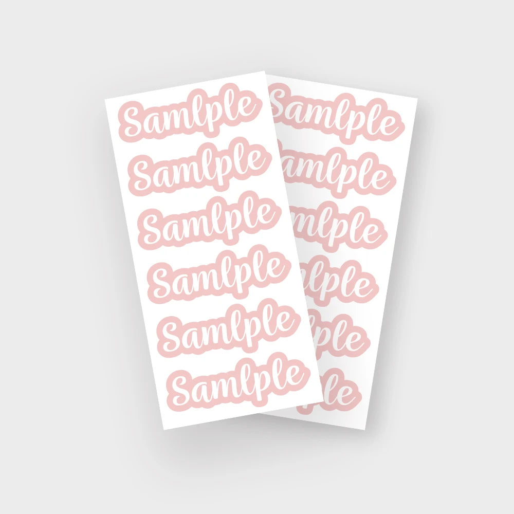 A sheet of pink name stickers with the word sample repeated on each label