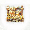 A wooden souvenir featuring two shaggy Highland cows and flowers with the word Scotland carved below.