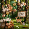 A balloon garland featuring safari jungle prints and various earth tones like olive green, gold, and brown.