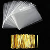 A stack of clear cellophane gift bags with gold twist ties.