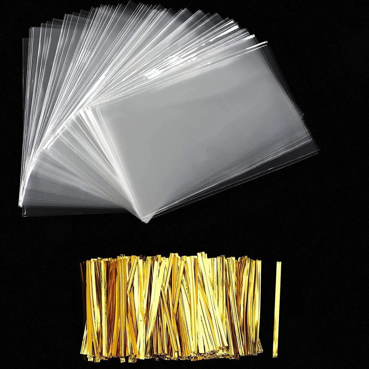 A stack of clear cellophane gift bags with gold twist ties.